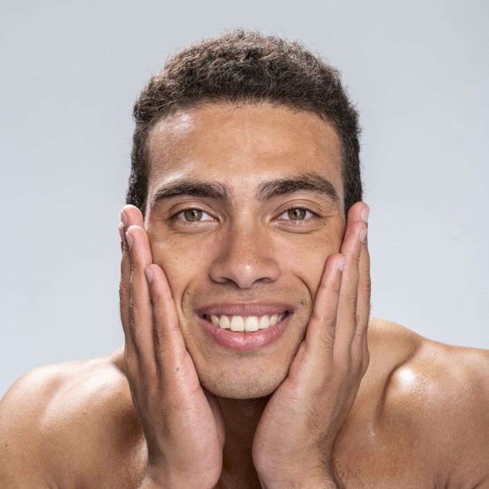cheerful man being happy after skin care procedures cheerful man being happy after skin care procedures