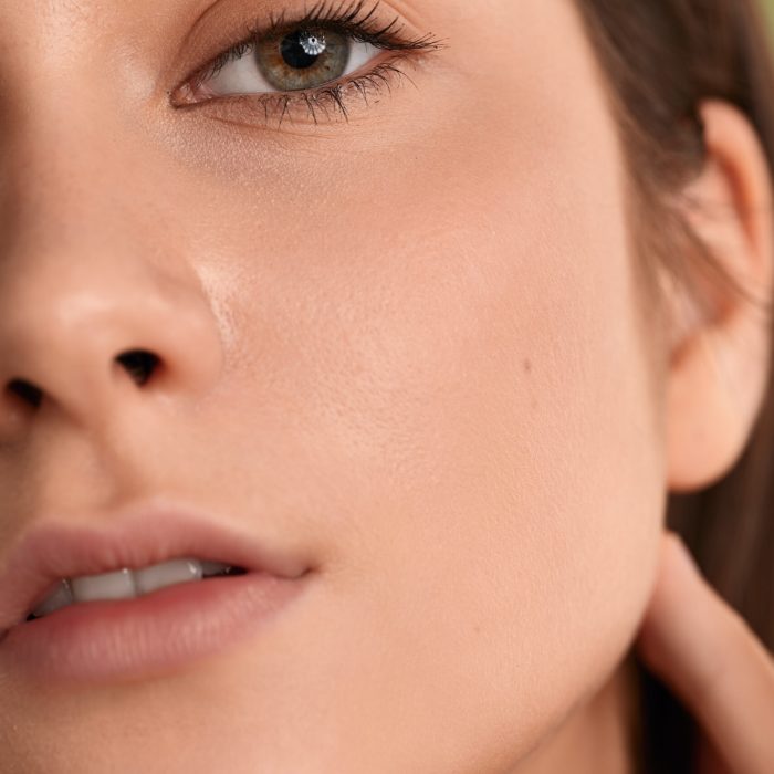 crop confident woman with natural makeup looking at camera